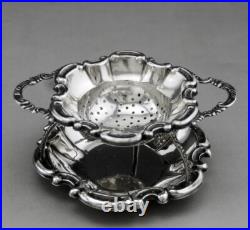 Jolie passe thé et son support en argent massif poinçon Allemand Allemagne