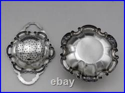 Jolie passe thé et son support en argent massif poinçon Allemand Allemagne