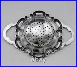 Jolie passe thé et son support en argent massif poinçon Allemand Allemagne