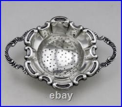 Jolie passe thé et son support en argent massif poinçon Allemand Allemagne