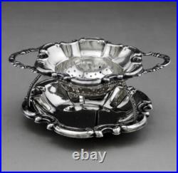 Jolie passe thé et son support en argent massif poinçon Allemand Allemagne