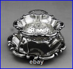 Jolie passe thé et son support en argent massif poinçon Allemand Allemagne