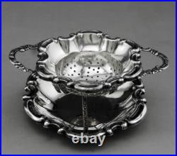 Jolie passe thé et son support en argent massif poinçon Allemand Allemagne