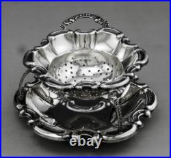 Jolie passe thé et son support en argent massif poinçon Allemand Allemagne